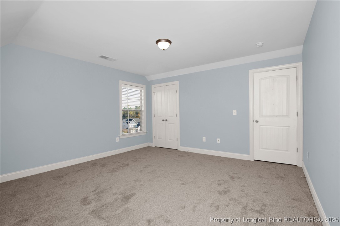 131 Revolutionary Road Cameron, NC 28326 - Photo 26 of 46 a view of an empty room with window and closet area