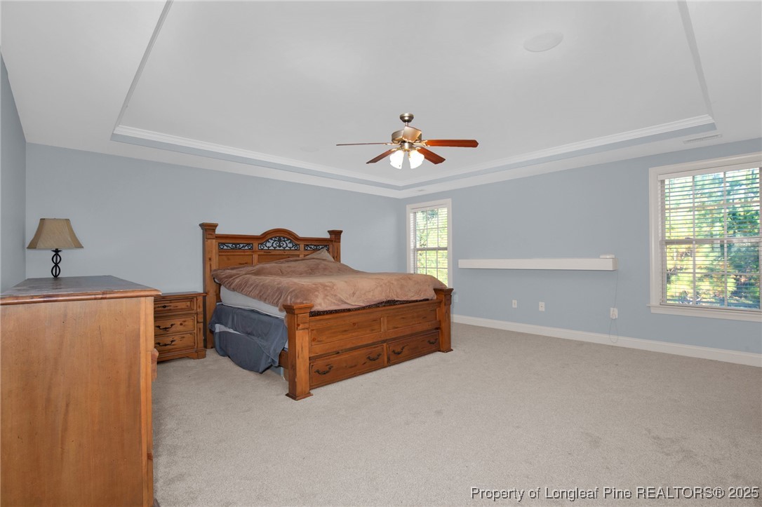 131 Revolutionary Road Cameron, NC 28326 - Photo 32 of 46 a bedroom with a bed and a window
