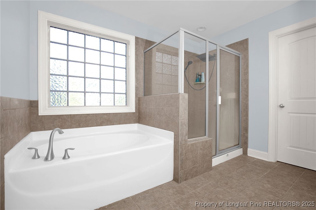 131 Revolutionary Road Cameron, NC 28326 - Photo 35 of 46 a bathroom with a tub shower and a sink