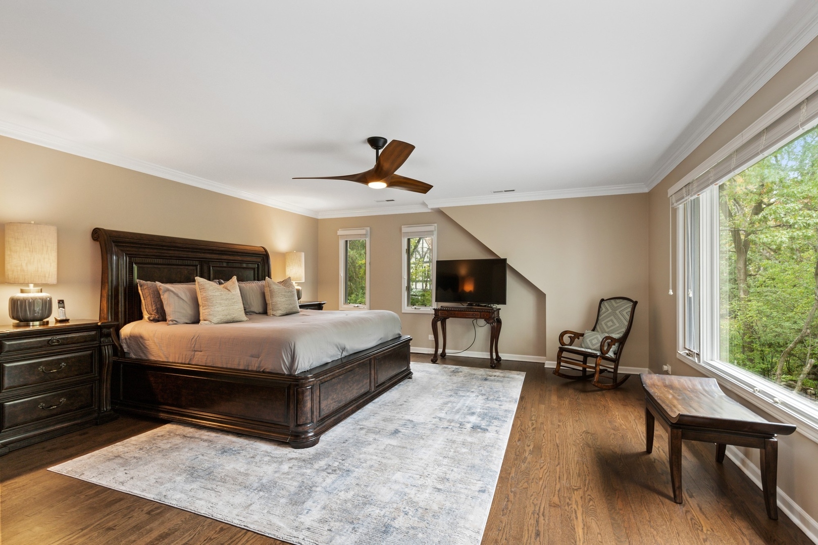 675 Rockefeller Road Lake Forest, IL 60045 - Photo 16 of 31 a bedroom with a bed large window and tv