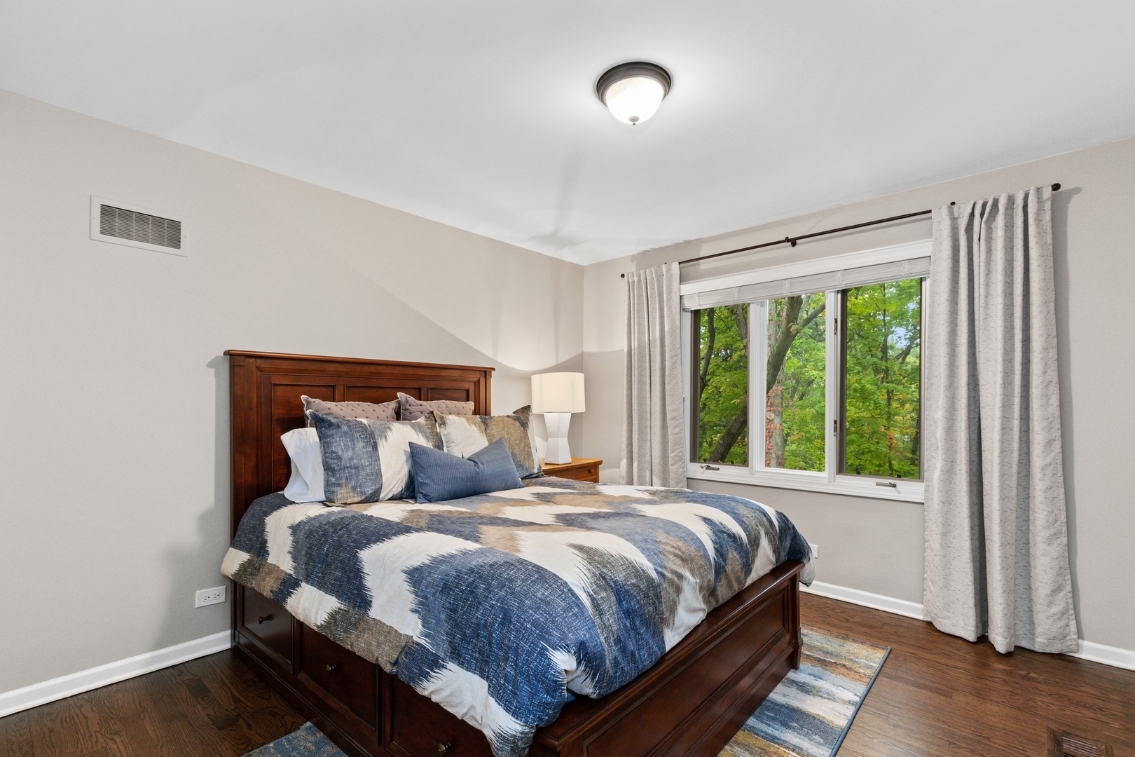 675 Rockefeller Road Lake Forest, IL 60045 - Photo 20 of 31 a bedroom with a bed and window