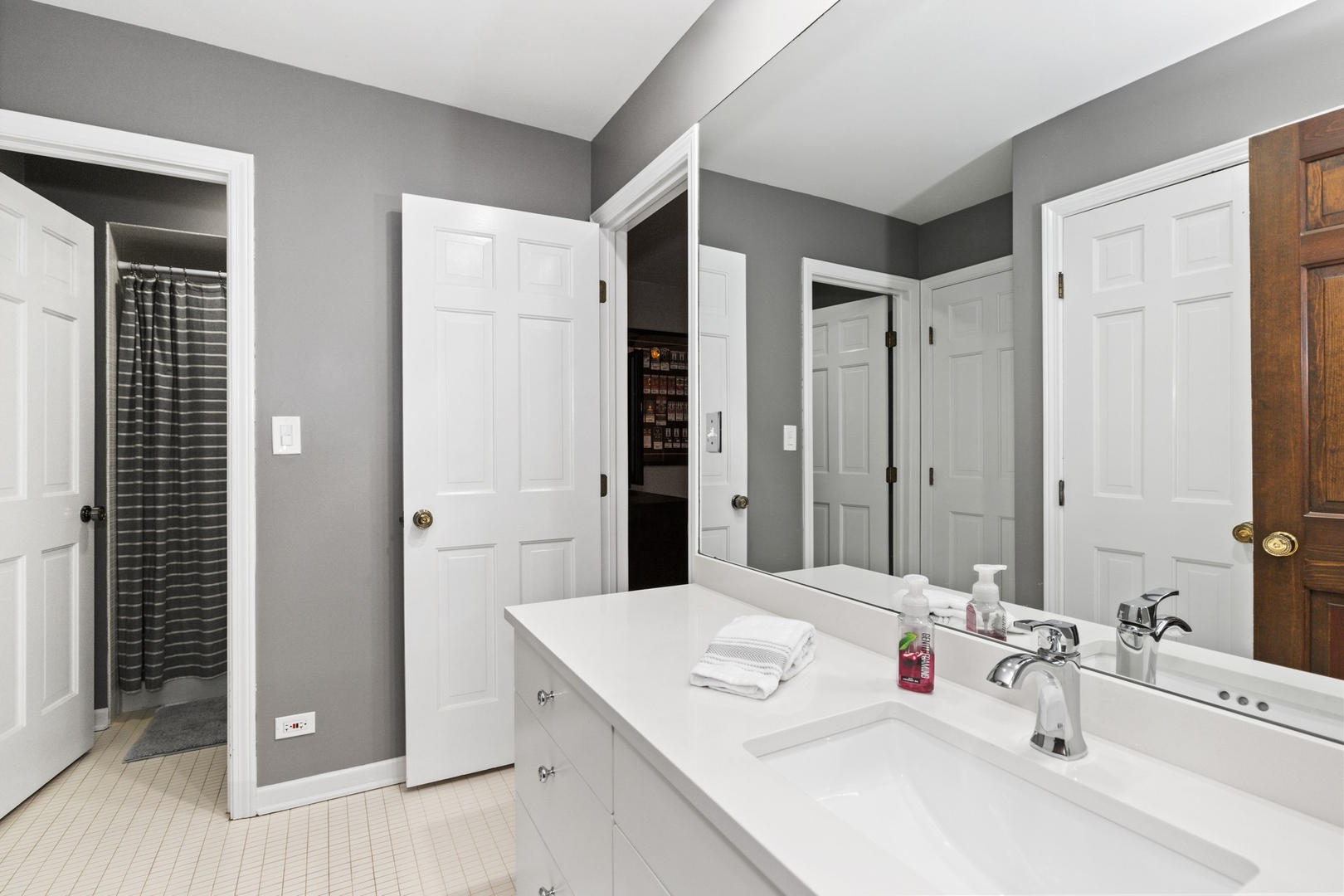 675 Rockefeller Road Lake Forest, IL 60045 - Photo 21 of 31 a bathroom with a sink and a mirror