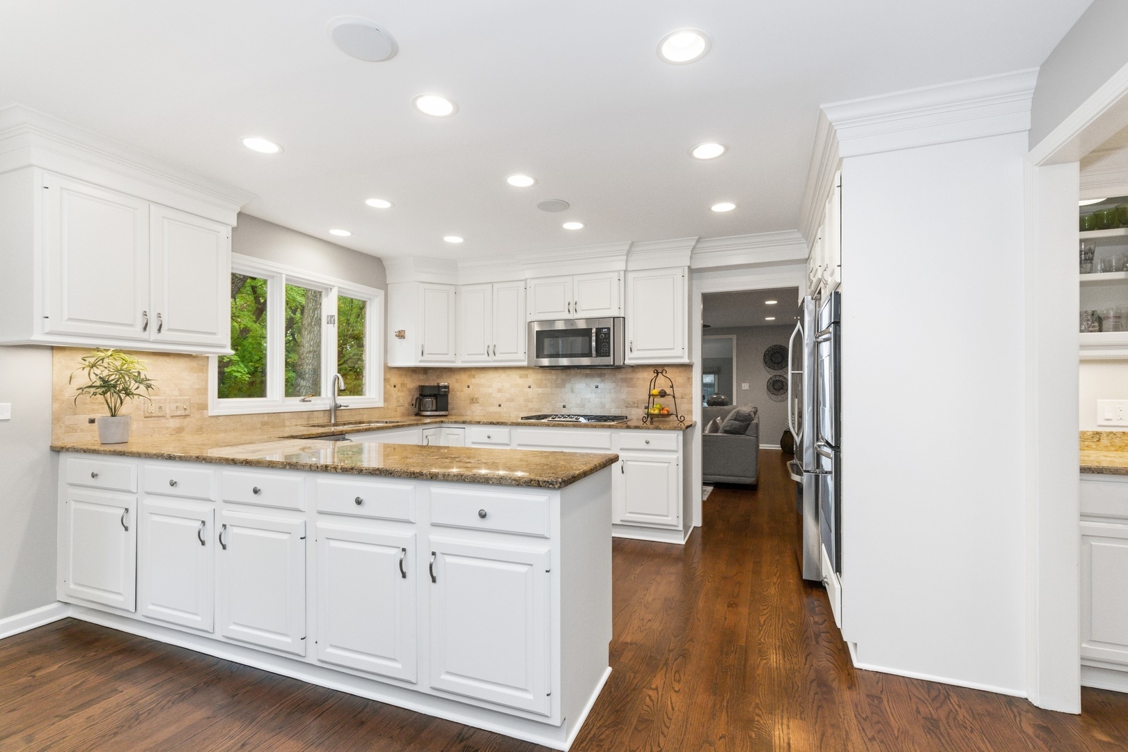 675 Rockefeller Road Lake Forest, IL 60045 - Photo 9 of 31 a kitchen with white cabinets and sink