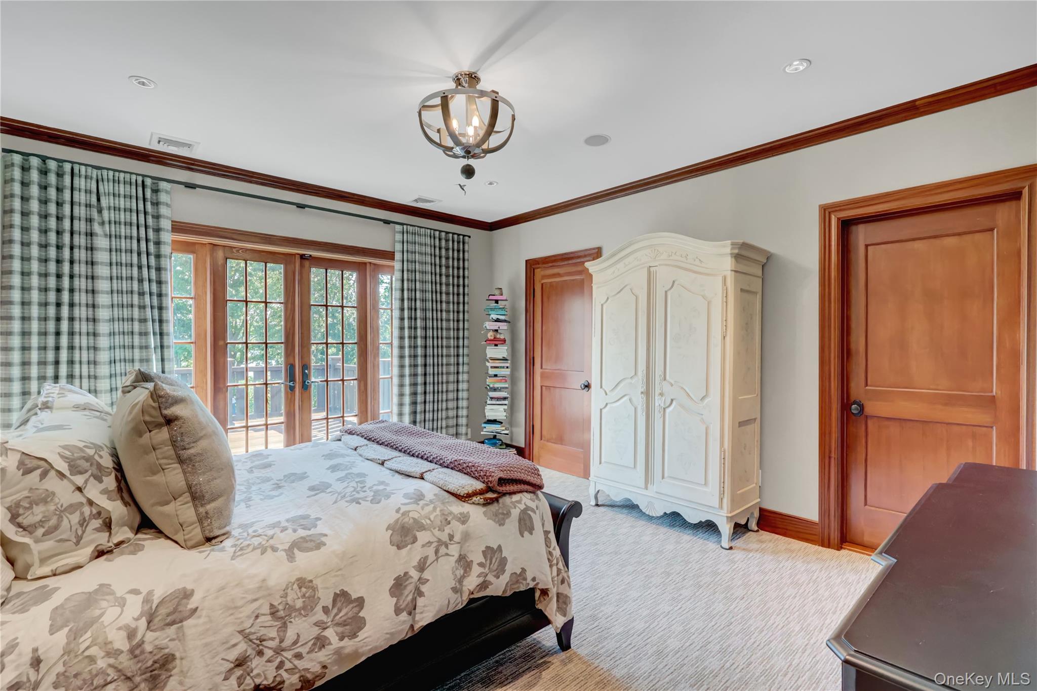 63 Dyke Road Setauket, NY 11733 - Photo 30 of 49 Carpeted bedroom featuring french doors, access to outside, and crown molding