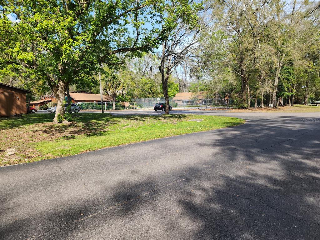 5823 Southwest 9th Place, Unit H55 Gainesville, FL 32607 - Photo 48 of 50 a view of a park with large trees