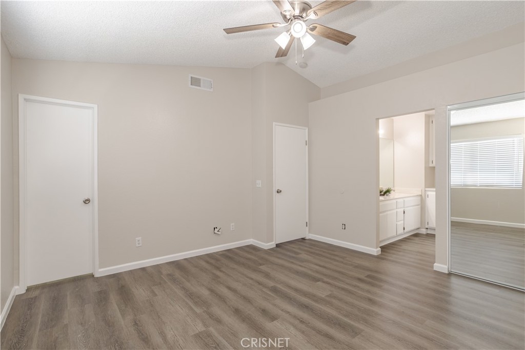 4224 Sorrell Avenue Palmdale, CA 93552 - Photo 19 of 34 an empty room with wooden floor and ceiling fan