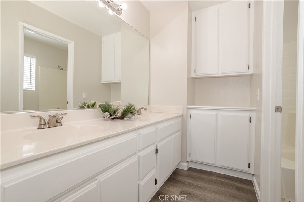 4224 Sorrell Avenue Palmdale, CA 93552 - Photo 20 of 34 a bathroom with a sink and a mirror