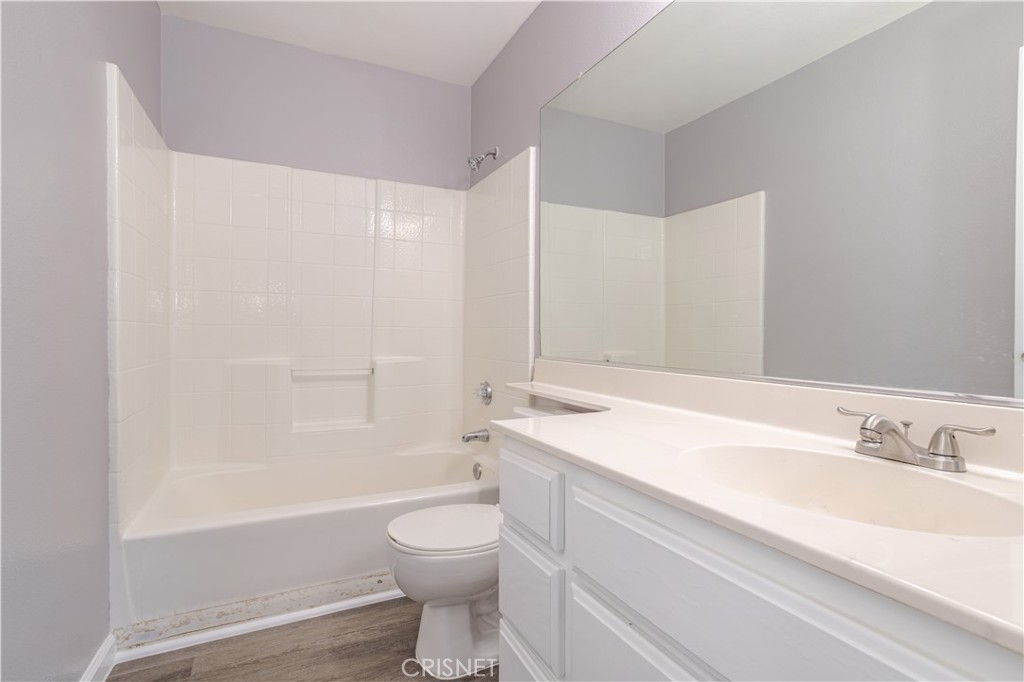 4224 Sorrell Avenue Palmdale, CA 93552 - Photo 21 of 34 a bathroom with a sink a toilet and bathtub