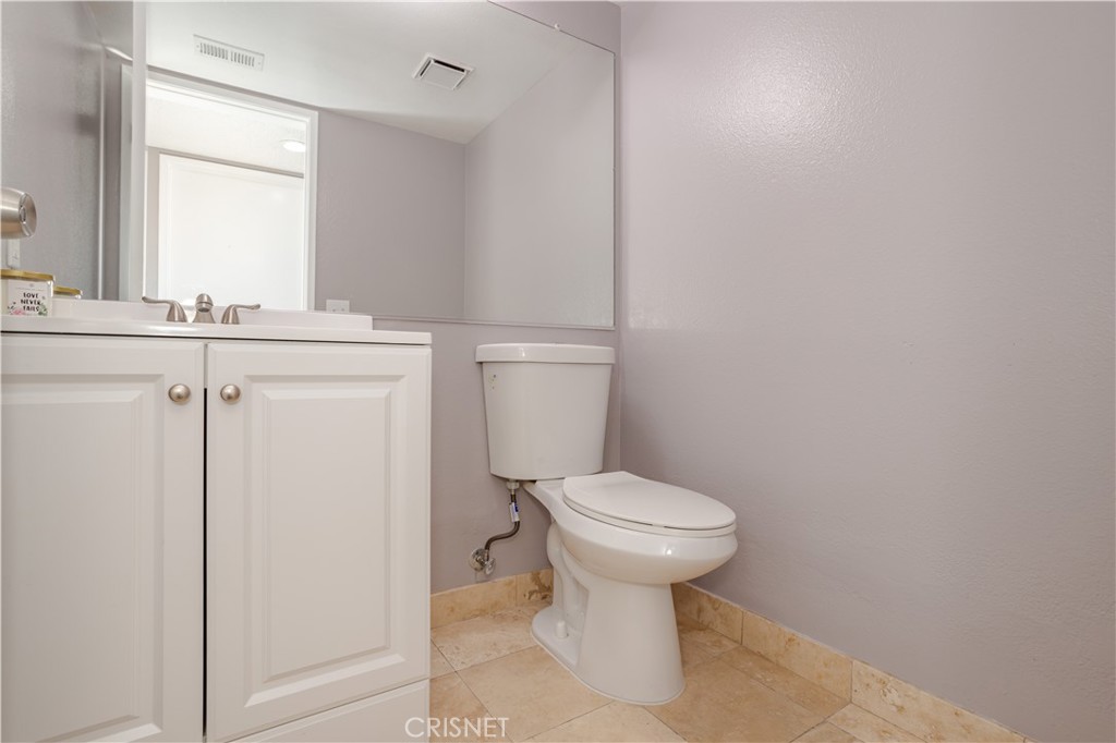 4224 Sorrell Avenue Palmdale, CA 93552 - Photo 23 of 34 a bathroom with a sink toilet and mirror