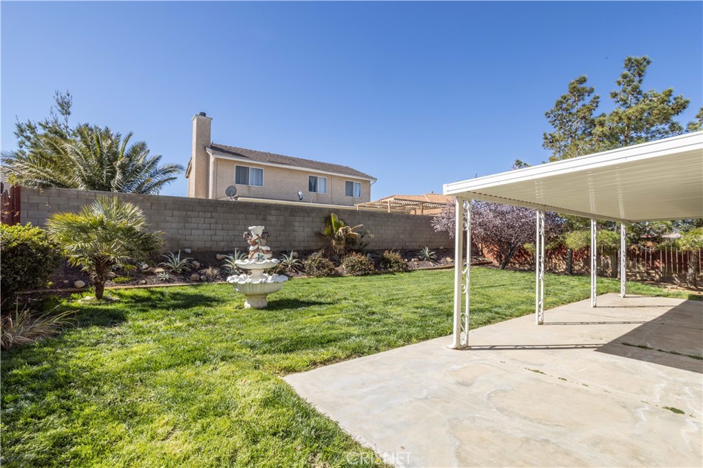4224 Sorrell Avenue Palmdale, CA 93552 - Photo 25 of 34 a view of a house with backyard and porch