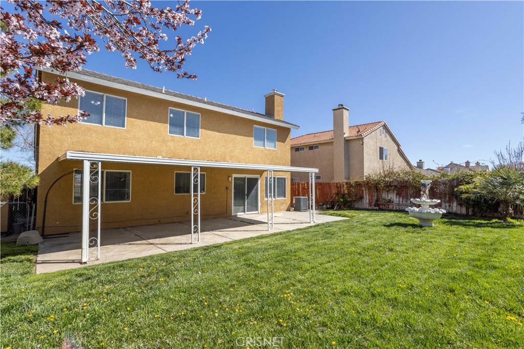 4224 Sorrell Avenue Palmdale, CA 93552 - Photo 26 of 34 a house that has a big yard and large trees