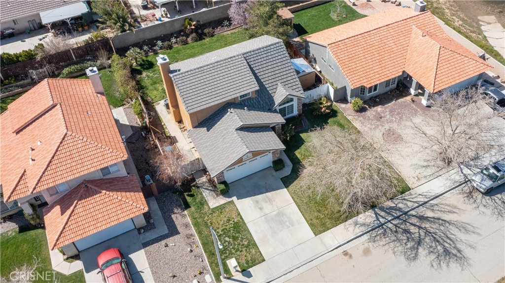 4224 Sorrell Avenue Palmdale, CA 93552 - Photo 28 of 34 an aerial view of a house with wooden stairs and a bench