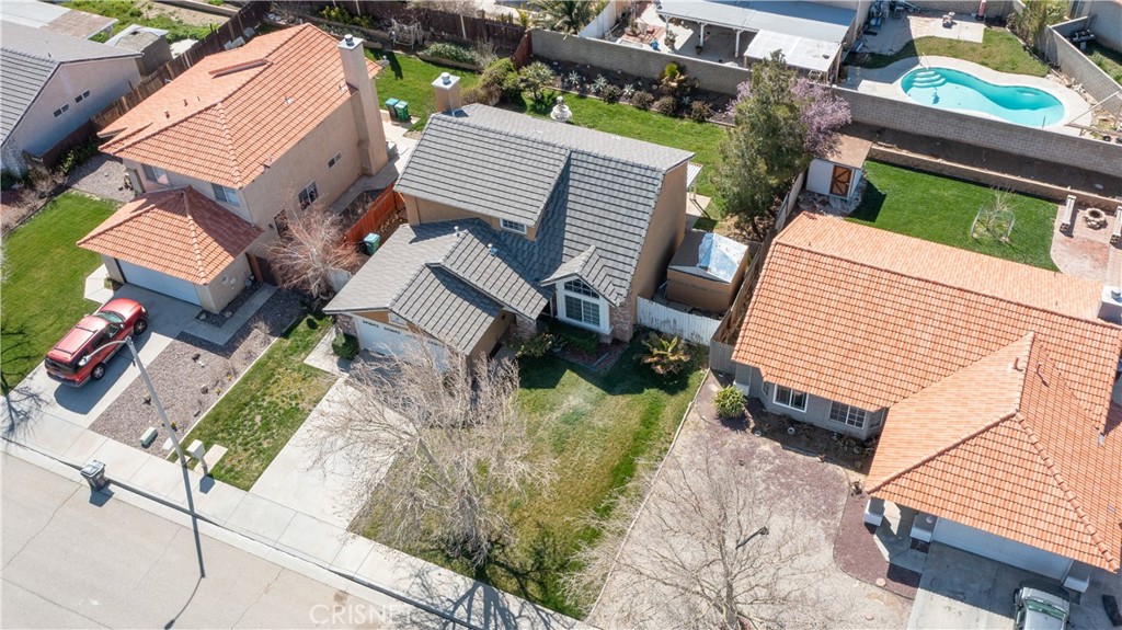 4224 Sorrell Avenue Palmdale, CA 93552 - Photo 29 of 34 an aerial view of a house with a yard and parking