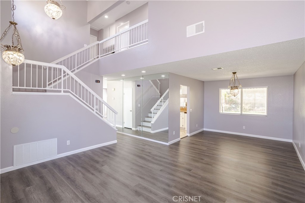 4224 Sorrell Avenue Palmdale, CA 93552 - Photo 6 of 34 a view of entryway and hall with wooden floor
