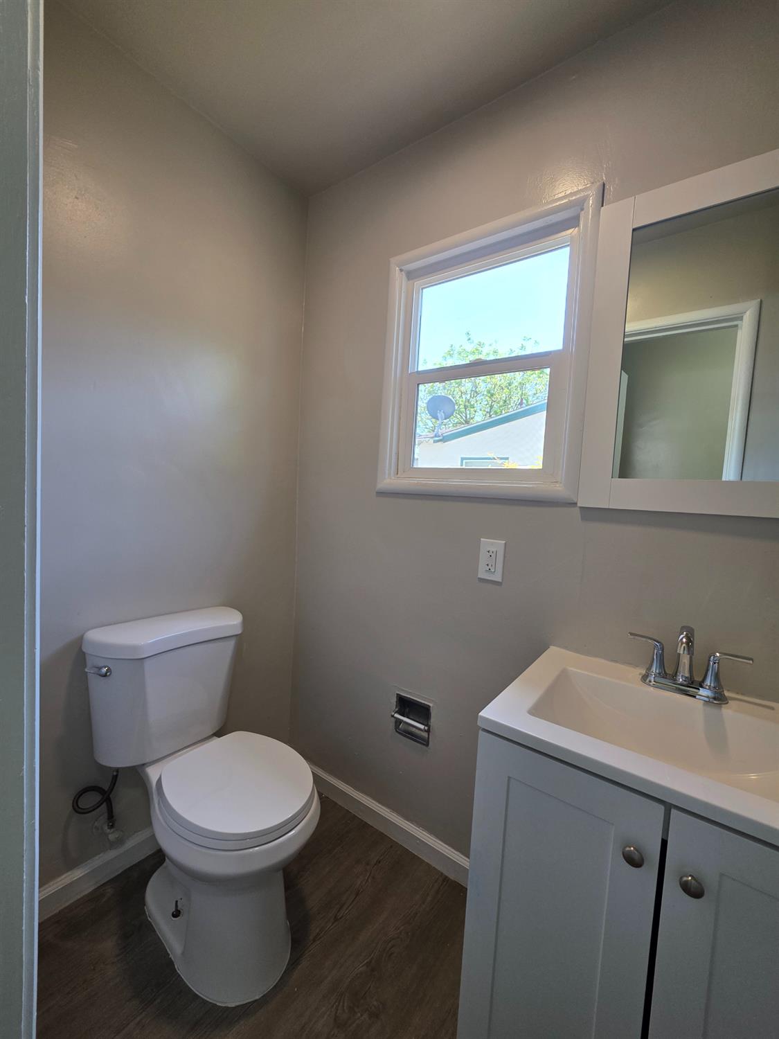 1416 Tully Road Modesto, CA 95350 - Photo 13 of 35 a white toilet sitting next to a bathroom sink