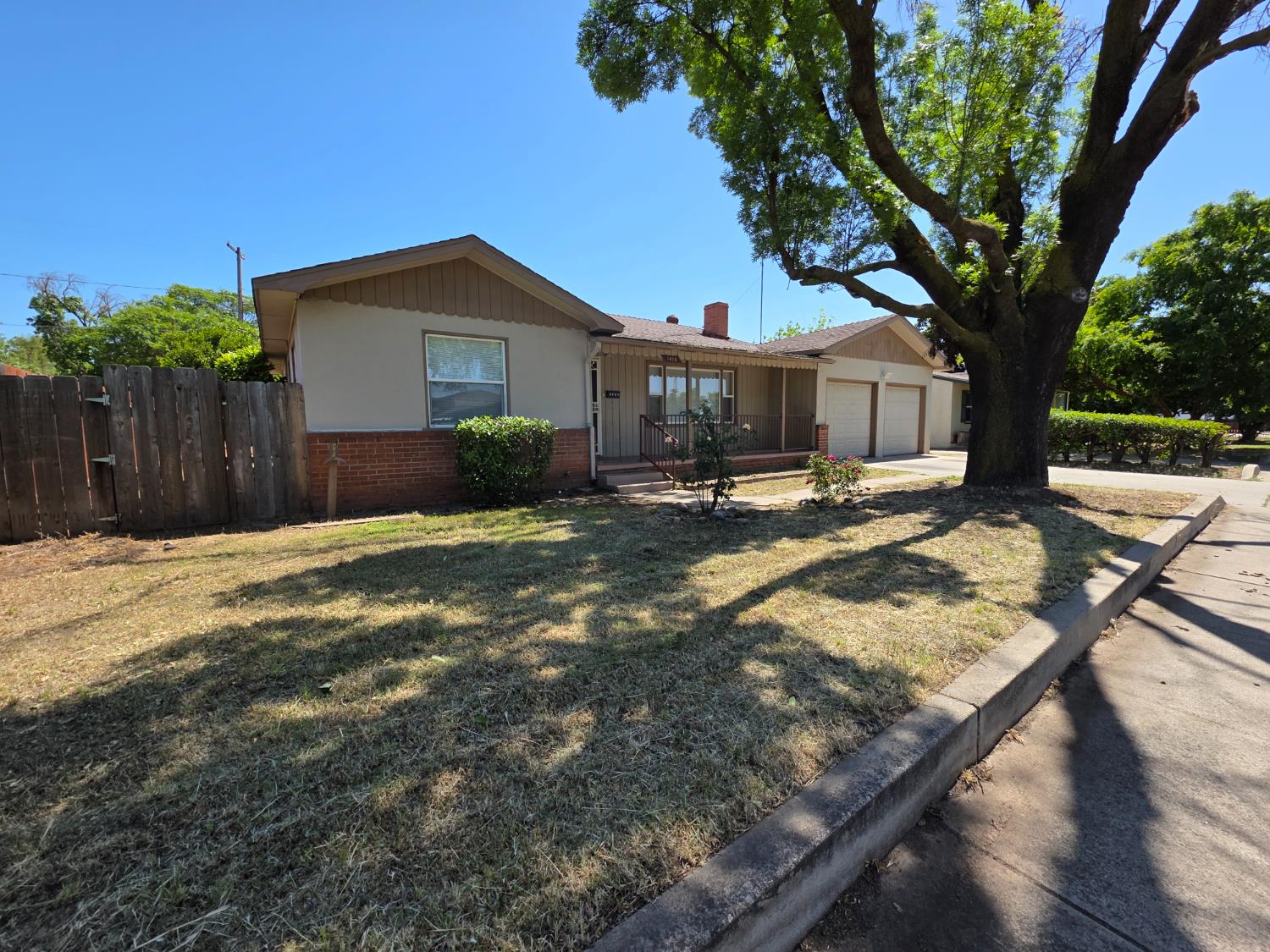 1416 Tully Road Modesto, CA 95350 - Photo 2 of 35 a backyard of a house with table and chairs