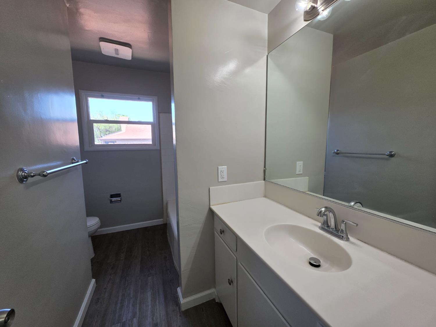 1416 Tully Road Modesto, CA 95350 - Photo 30 of 35 a bathroom with a sink and a mirror