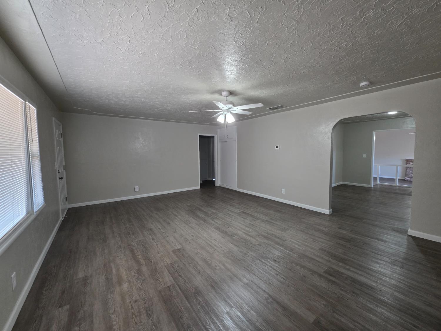 1416 Tully Road Modesto, CA 95350 - Photo 6 of 35 a view of a room with wooden floor