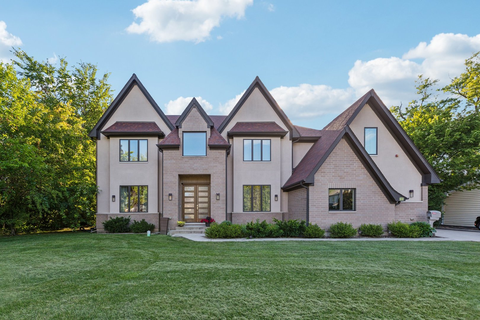 264 Linden Road Northbrook, IL 60062 - Photo 1 of 88 a front view of a house with a yard and trees