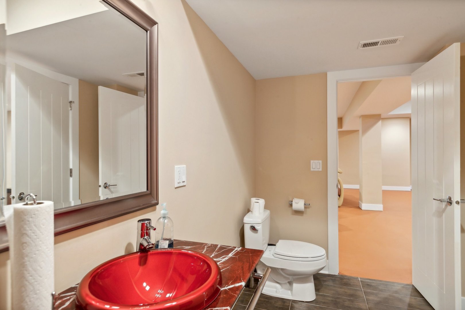264 Linden Road Northbrook, IL 60062 - Photo 64 of 88 a bathroom with a toilet sink vanity and mirror