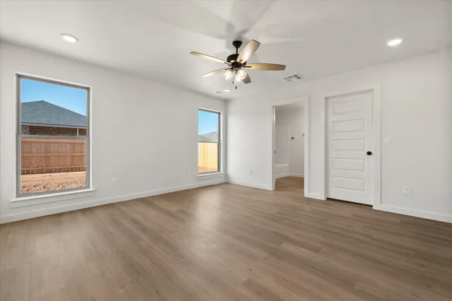 a kitchen with a white cabinets and white appliances