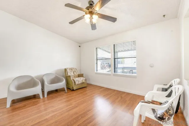 a view of an entryway with wooden floor
