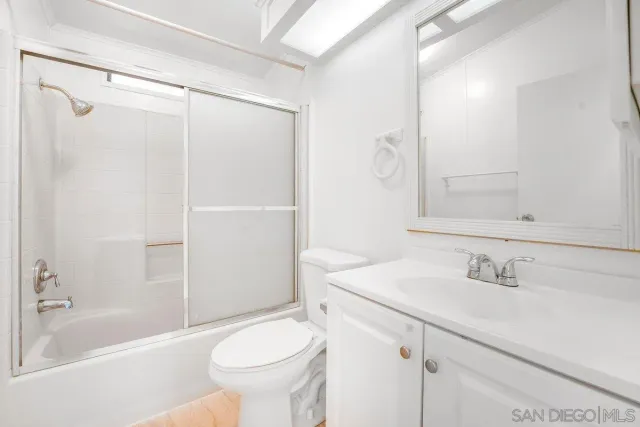 a view of a storage and utility room with washer and dryer