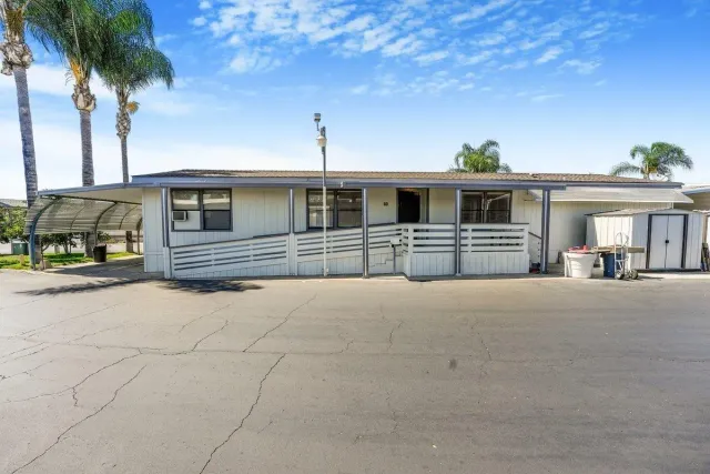 a view of a house with outdoor kitchen