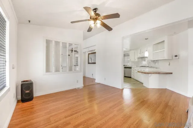 a living room with furniture and windows