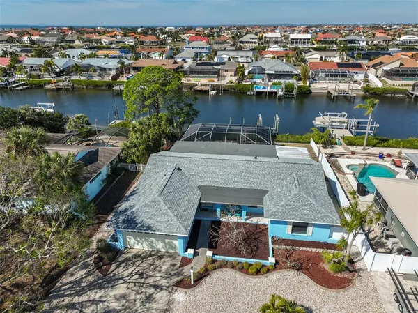 an aerial view of a house with a lake view