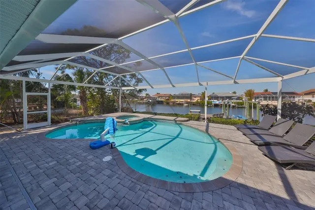 a view of a swimming pool with a patio