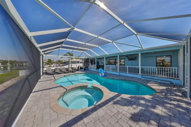 a view of swimming pool with outdoor seating
