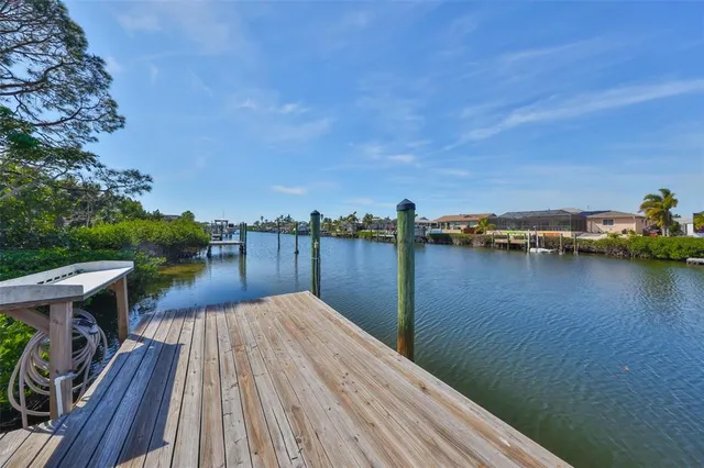 a view of a house with wooden floor and lake view