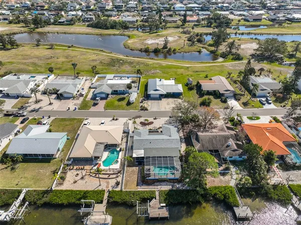 an aerial view of residential houses with outdoor space