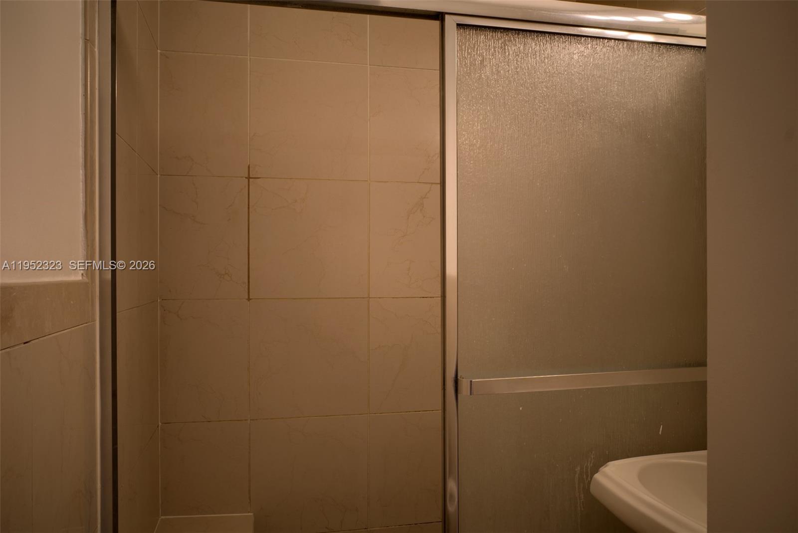 43 Southwest 11th Street, Unit W Dania Beach, FL 33004 - Photo 14 of 23 a bathroom with a shower