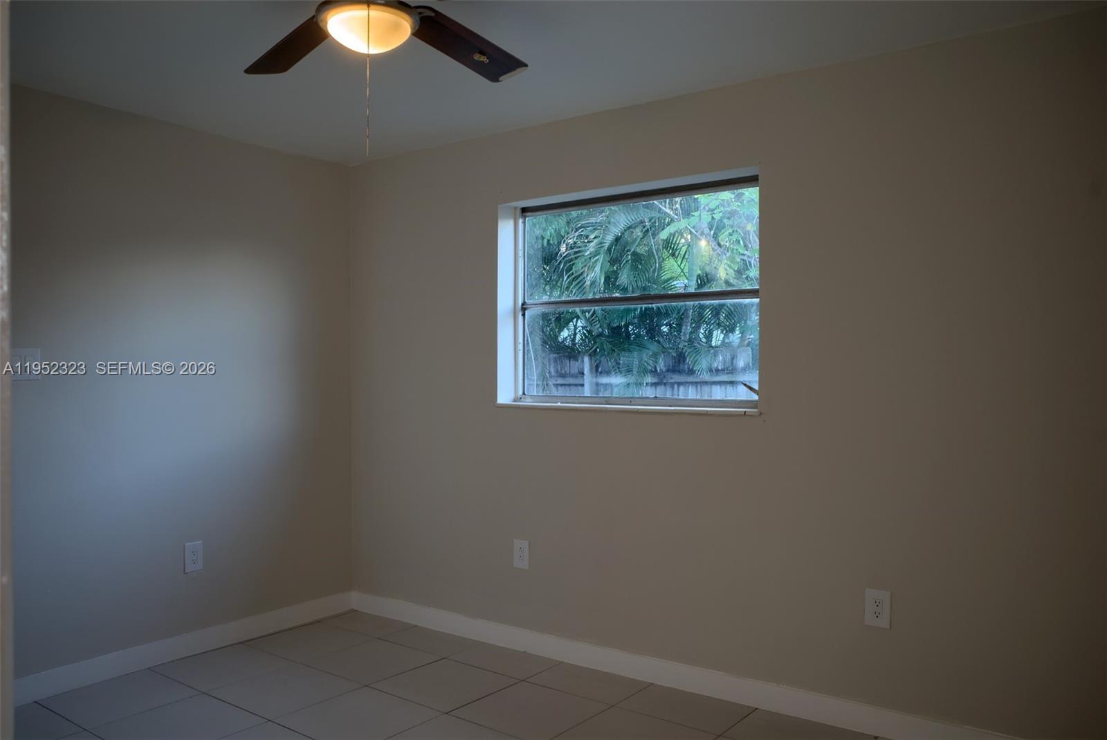 43 Southwest 11th Street, Unit W Dania Beach, FL 33004 - Photo 15 of 23 an empty room with a window