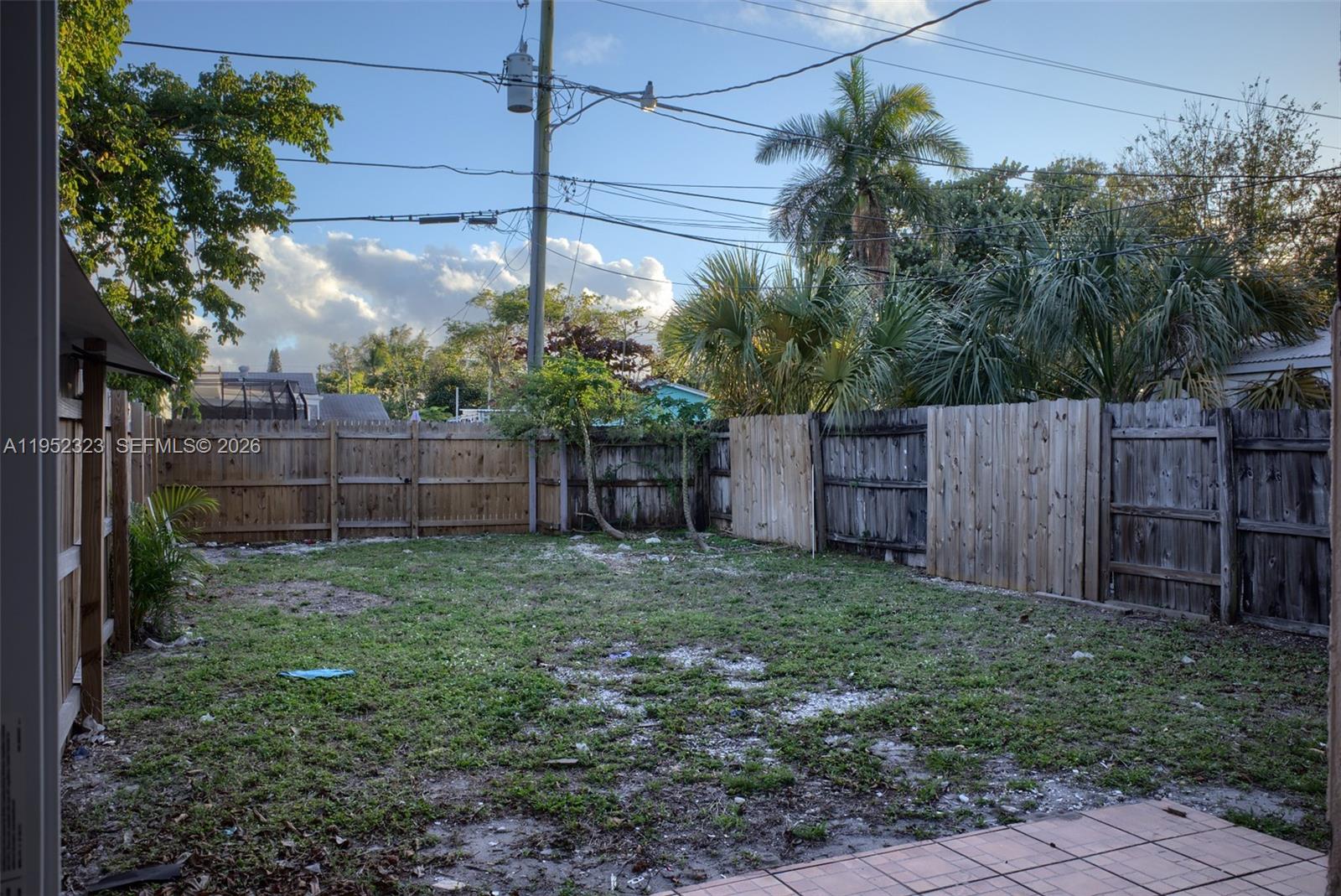 43 Southwest 11th Street, Unit W Dania Beach, FL 33004 - Photo 17 of 23 a view of a backyard with green space