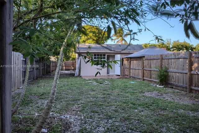 a backyard of a house with lots of green space