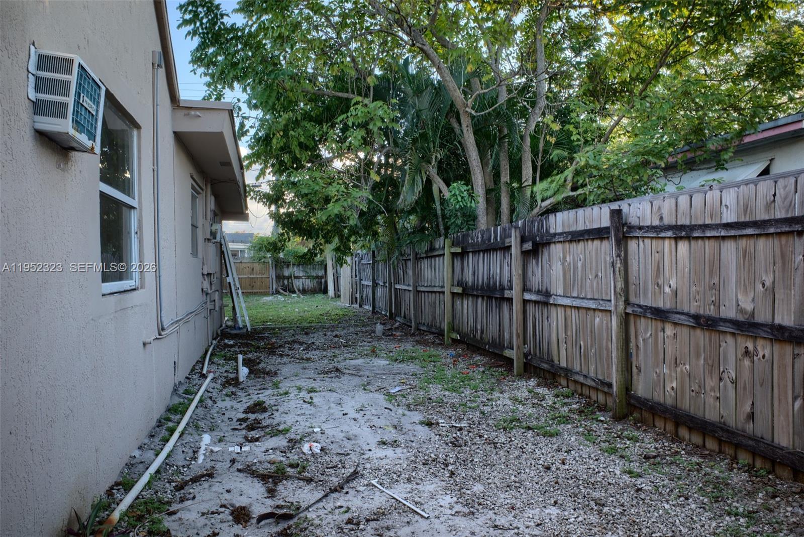 43 Southwest 11th Street, Unit W Dania Beach, FL 33004 - Photo 21 of 23 a backyard of a house with lots of green space