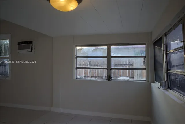 a view of an empty room with a fireplace