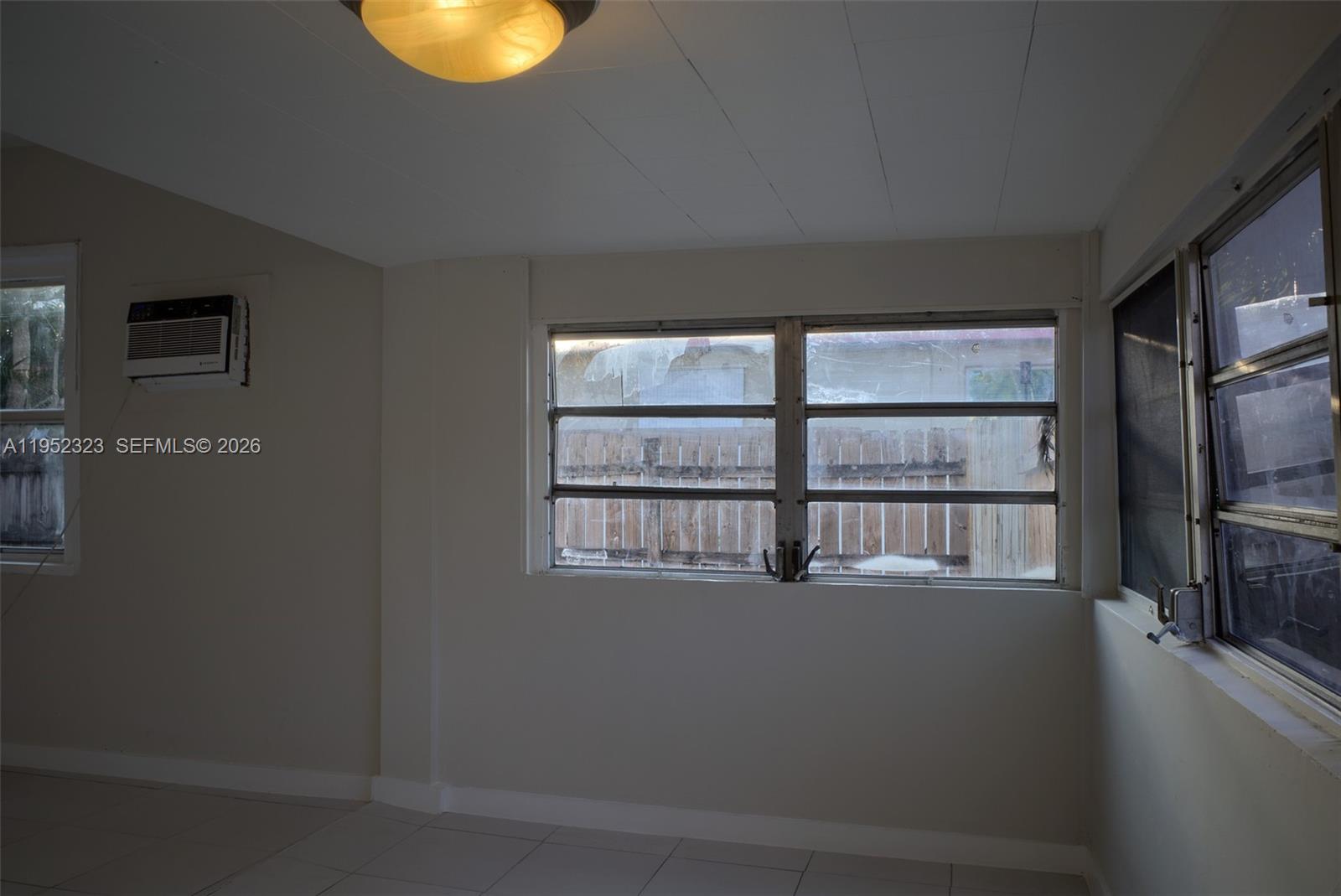 43 Southwest 11th Street, Unit W Dania Beach, FL 33004 - Photo 7 of 23 a room with a window