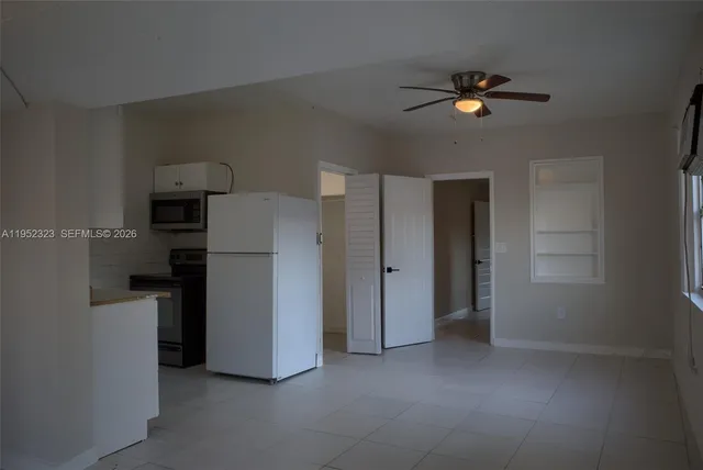 a kitchen with cabinets and appliances