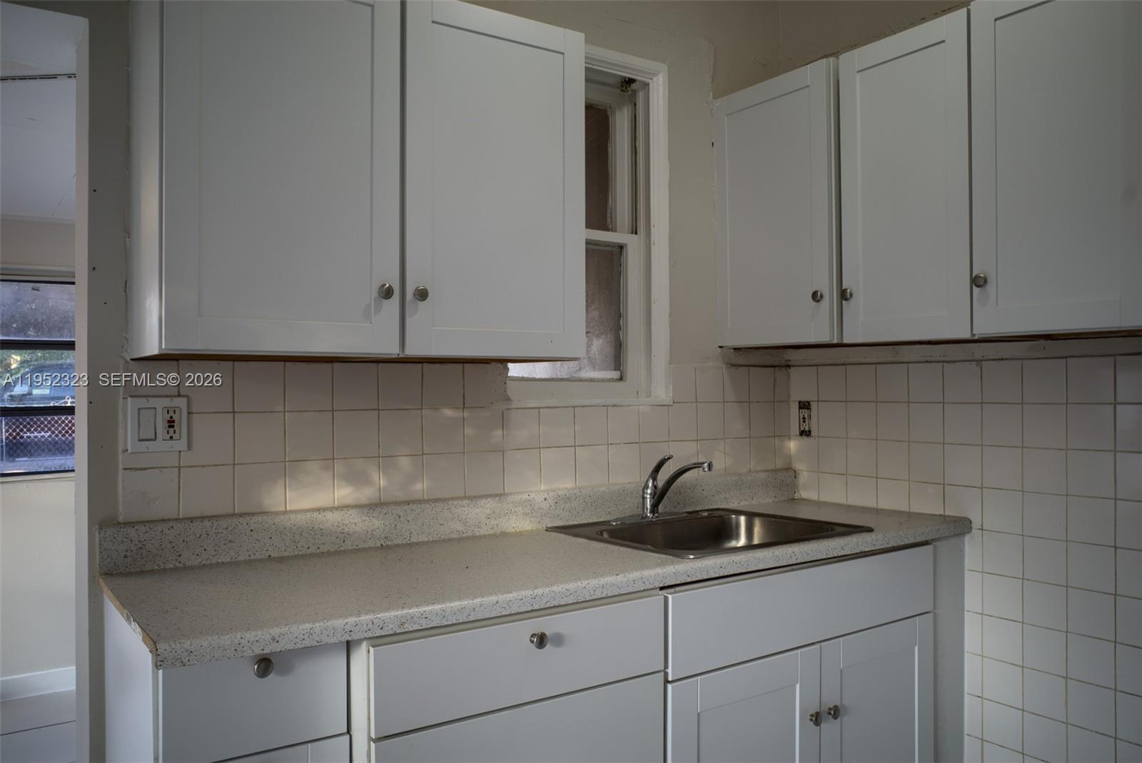 43 Southwest 11th Street, Unit W Dania Beach, FL 33004 - Photo 10 of 23 a kitchen with a sink and cabinets