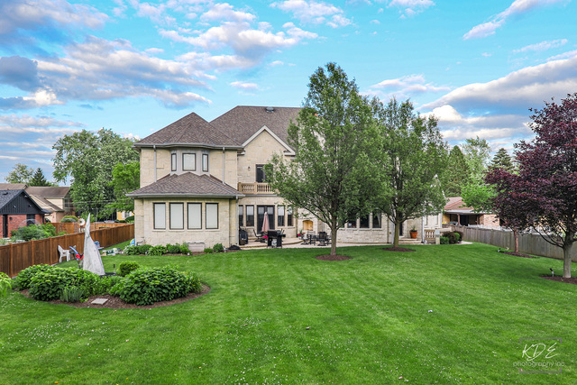904 South Edgewood Lane Mount Prospect, IL 60056 - Photo 54 of 59 a view of a house with a big yard and potted plants
