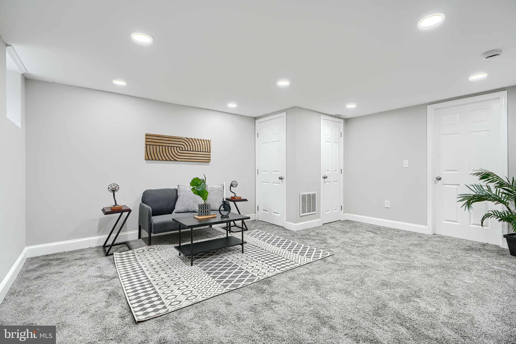 4004 Fairfax Road Baltimore, MD 21216 - Photo 18 of 23 a living room with furniture and a potted plant