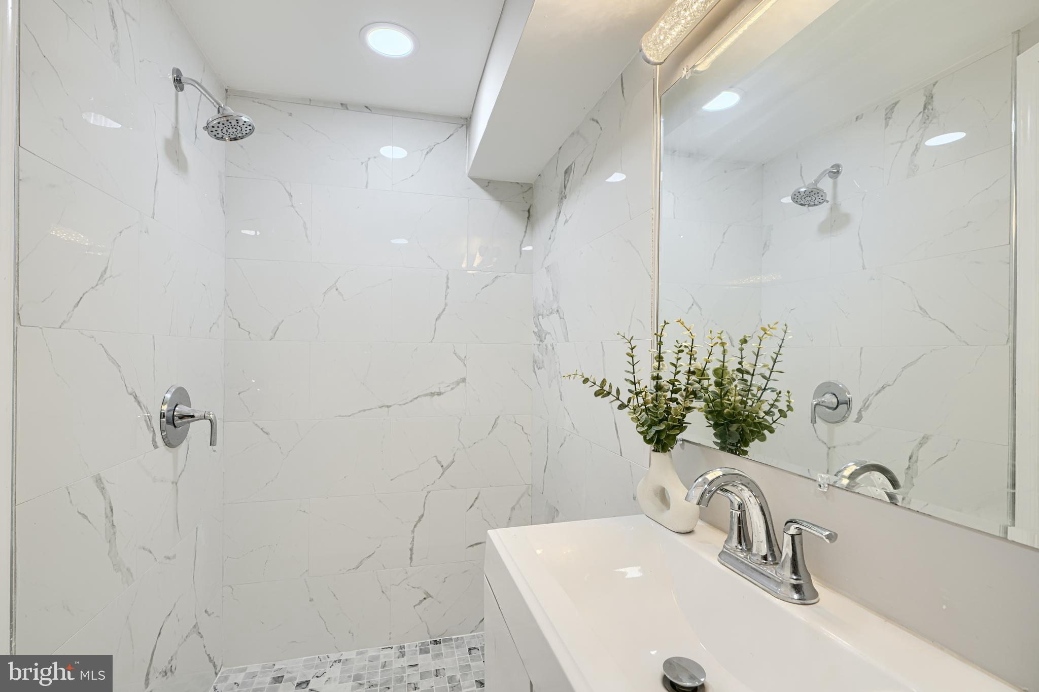 4004 Fairfax Road Baltimore, MD 21216 - Photo 20 of 23 a bathroom with a sink and a mirror