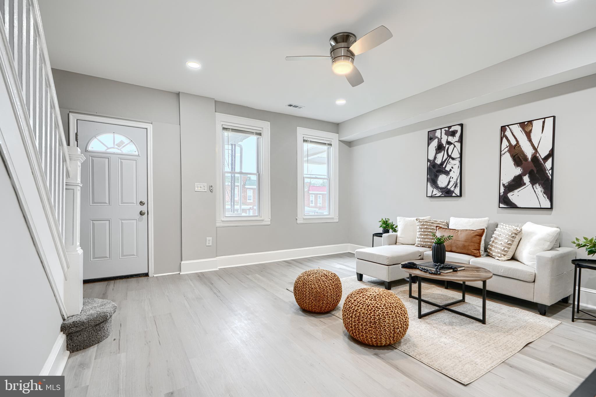 4004 Fairfax Road Baltimore, MD 21216 - Photo 4 of 23 a living room with furniture a window and wooden floor