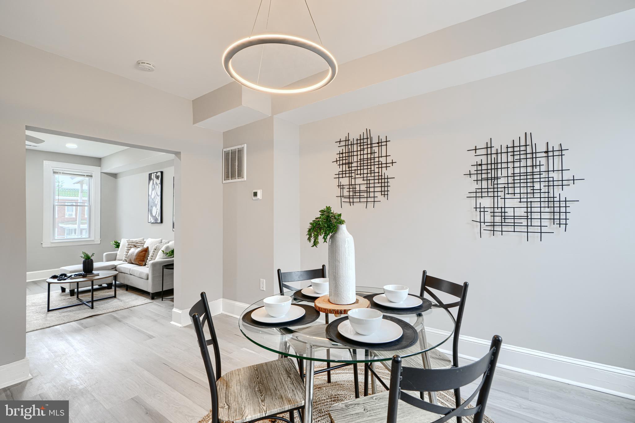 4004 Fairfax Road Baltimore, MD 21216 - Photo 6 of 23 a view of a dining room with furniture and wooden floor