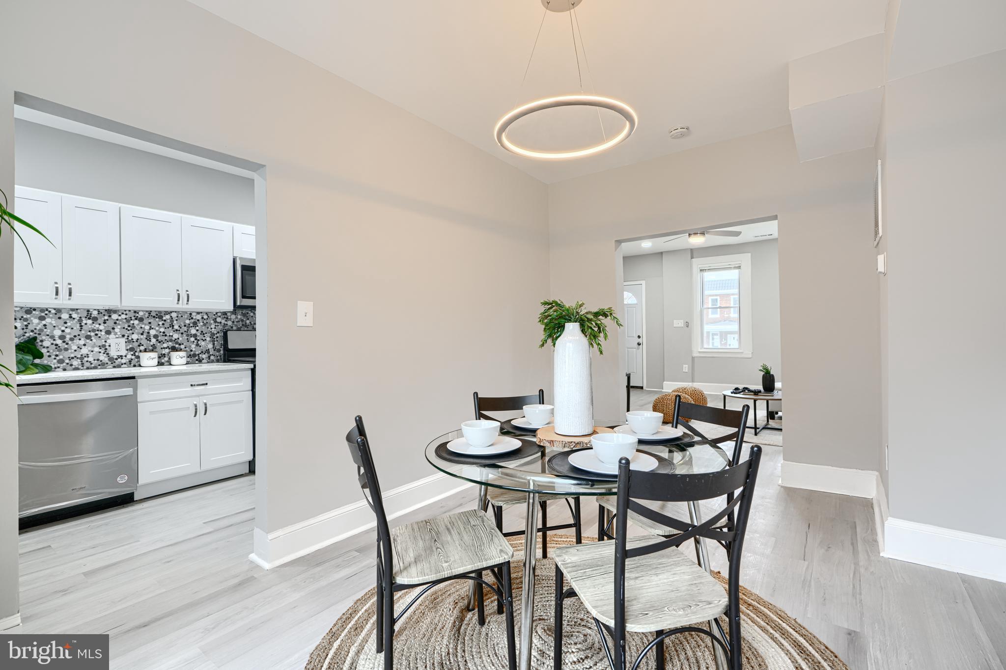 4004 Fairfax Road Baltimore, MD 21216 - Photo 7 of 23 a view of a dining room with furniture and wooden floor