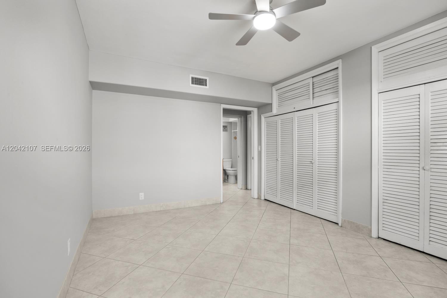 3213 Colony Club Road, Unit 3E Pompano Beach, FL 33062 - Photo 27 of 31 a view of an empty room with a window